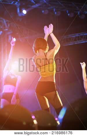 Beautiful girl dancing on stage at night party,Dancing happy new year