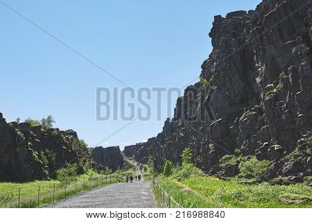 walkway in Thingvellir National Park, Iceland. Thingvellir National Park - famous area in Iceland right on the spot where the atlantic tectonic plates meets. UNESCO World Heritage Site