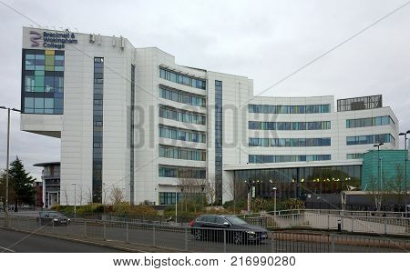 Bracknell, England - Dec 06, 2017: Traffic passes in front of the Bracknell & Wokingham College building, a source of further education for school leavers and adults in Bracknell, England