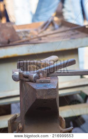 blacksmith tools and fixtures for hand forged metal, close-up
