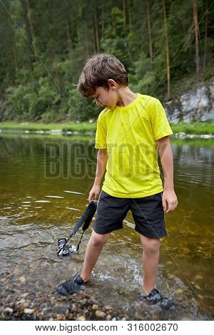 A Young Bully Destroyed Of The Camera Of His Parents. The Boy Drowned The Camera In The River, And T