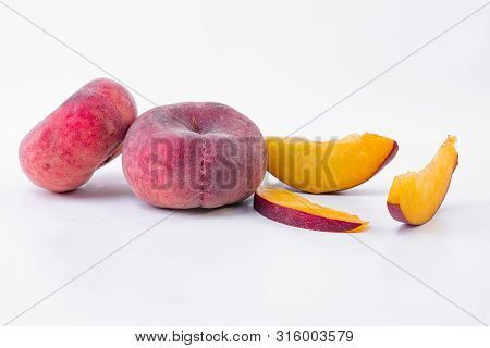 Whole Flat Peach And Slices Of Flat Peach - Ripe Flat Peach - On A White Background