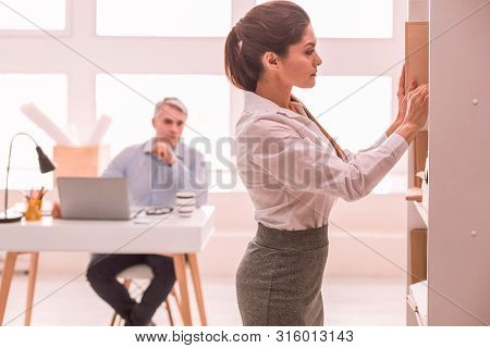 Young Long-haired Woman Working In The Office