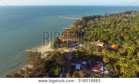 Beautiful Coastal View Of Wide Tropical Beach With White Sand,coconut Trees And Azure Water On Pohon