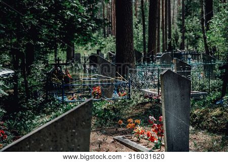 Old Christian Cemetery With Tombstones And Crosses In A Forest In Europe Former Soviet Union