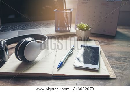 Diary And Smartphone For Planning Work Schedules And Appointments.desktop Laptop,headaphone,calendar