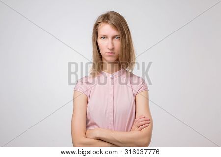 Dissatisfied Young Woman Looking Angrily At Camera, Showing Irritated Face Expression