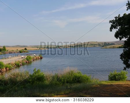 Scenic View Of Lake Elmer Thomas, Oklahoma With A Dock On One Side