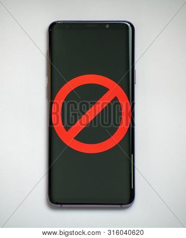 Red Prohibition Sign On The Smartphone Screen