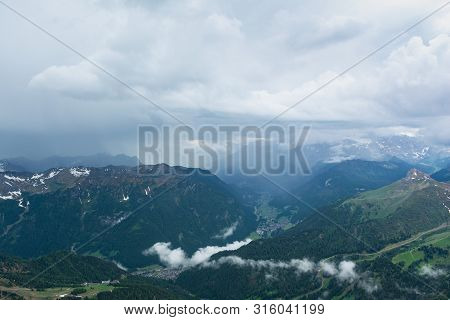 Rain Shaft And Thunderstorm Over Fassa Valley (val Di Fassa). Do