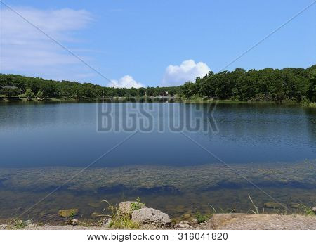 Wide Shot Of A Lake At Chickasaw National Recreation Area In Davis, Oklahoma