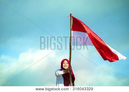Indonesian Flag With Blue Sky Background, Merah Putih On Indonesian Independence Day