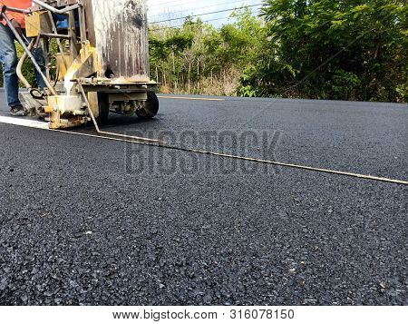 Road Traffic Paint On The Asphalt Surface And To Ensure Safety