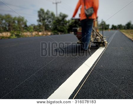 Road Traffic Paint On The Asphalt Surface And To Ensure Safety