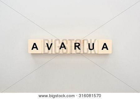 Top View Of Wooden Blocks With Avarua Lettering On Grey Background