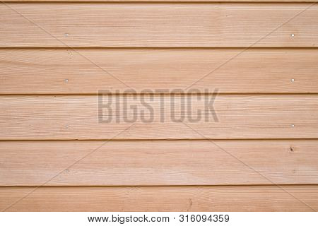 Texture Of Beige And Brown Wood Planks Held Together By Nails.