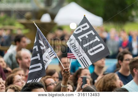 Houston, Texas - March 30, 2019: Supporter Holds Flags Beto For America During Beto Orourke Campaign