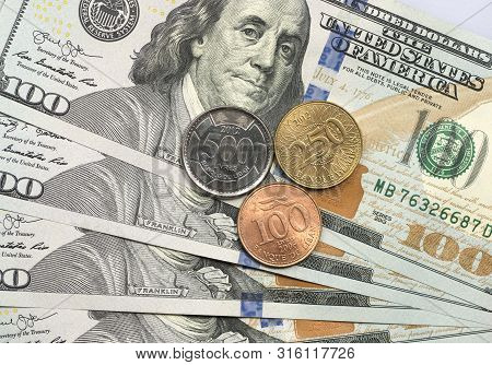 Lebanese Pound Coin On Top Of Dollar Bills For Financial And Investment Concepts