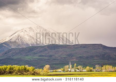 Mount Kose In Turkey Near Agri With Snow And Green Meadows