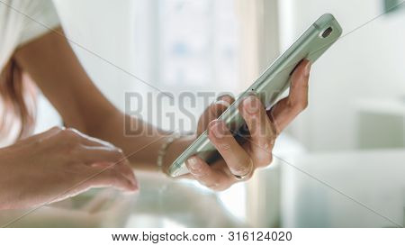 Close Up Of Aboriginal Hand Using Smartphone And Dressed A Traditional Clothes Of The Tribe. Taiwane