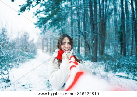 Winter Girl. Outdoor Portrait Of Young Pretty Beautiful Woman In Cold Sunny Winter Weather In Park