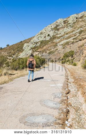Beautiful Woman Hiking On Mountain Path During Winter Or Autumn In Catalonia (turo Del Home - Spain)