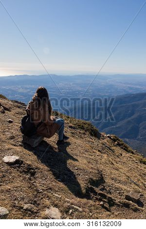 Beautiful Woman Sitting After Hiking During Winter Or Autumn In Catalonia (turo Del Home - Spain)