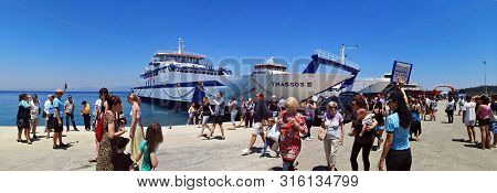 Thasos, Greece - July 7, 2019 : Tourists Getting Off The Thasos Ii Ferryboat