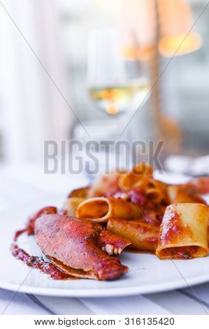 Pasta With Spiny Lobster And Tomato Sauce. Seafood Lunch At The Restaurant And A Glass Of White Wine