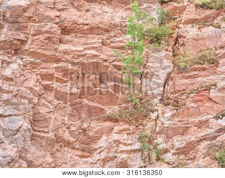 Ancient Multi-layered Lime And Feric Lines In Wall Surface Of Mine Rocks