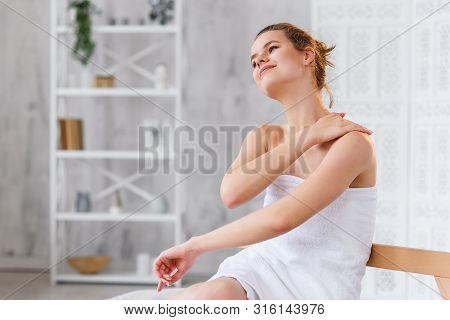 Cute Caucasian Woman Applies Natural Moisturizer Cream On Gentle Smooth Skin After On The White Spa 