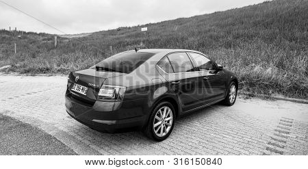 Overveen, Netherlands - Aug 16, 2018: Rear View Of New Skoda Octavia Parked On A Beach Park Space In