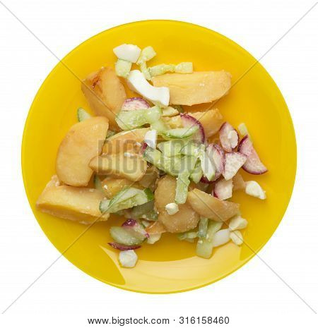 Potato Wedges With Vegetables On A Yellw Plate Isolated On White Background. Junk Food . Rustic Food