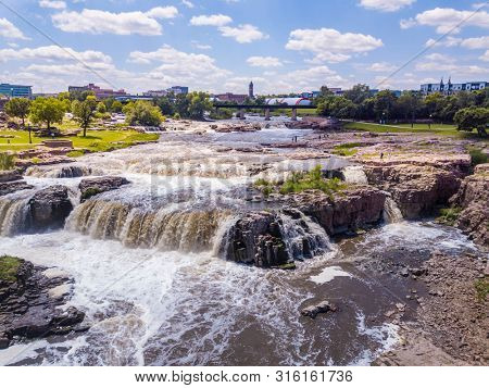Low aerial view of the waterfall in Sioux Falls, South Dakotaâs largest city.