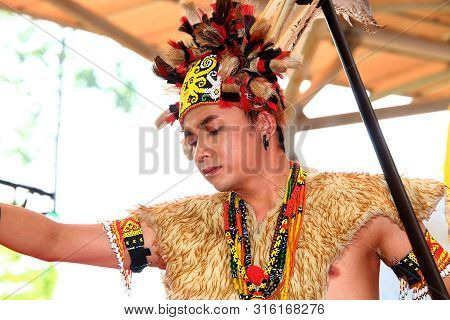 Selangor, Malaysia - August 04, 2019:   Iban Traditional Dance Performer From Sarawak Tribe During T