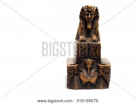 Sphinx Figurine Stands On A White Background