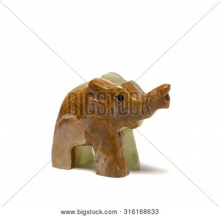Figurine Of An Elephant From Malachite On A White Background