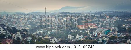 Vietnam's littel Paris Da Lat cityscape. Copy of Eiffel tower on background. View from the mountain of Dalat, Vietnam. High resolution panorama