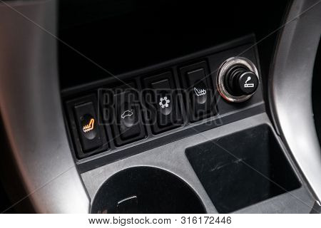 Novosibirsk, Russia - July 30, 2019: Lifan X60, Close-up Of Seat Heating Buttons, Cigarette Lighter.