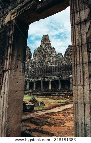 Rustic Stone Entrance To Ankgor Thom Ruins In Cambodia