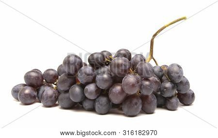 Bunch Of Grapes Lies On A White Background