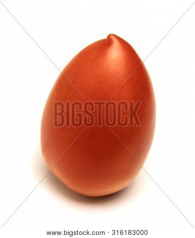 Red And Ripe Tomato Lies On A White Background