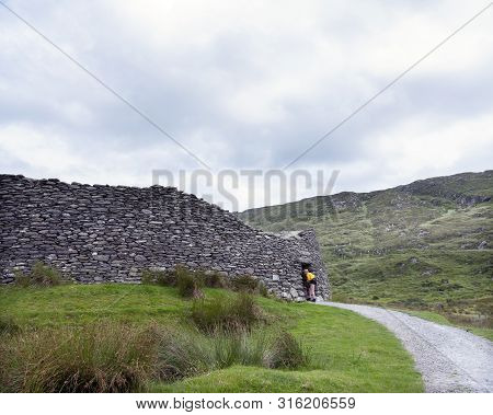 Kerry, Ireland, 26 July 2019: Tourists On Staigue Stone Fort On Kerry Peninsula In Ireland
