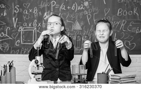 Girls Study Chemistry. Make Studying Chemistry Interesting. Microscope And Test Tubes On Table. Educ