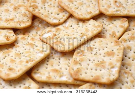 Tuc Original Snack Crackers Lies On Market Table Stacked In Big Pile