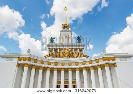 Moscow, Russia - July 22, 2019: Facade Of Pavilion Ussr On Vdnh In Moscow Against Blue Sky With Whit