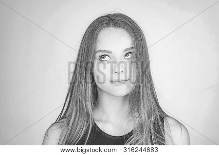 Close Up Portrait Of A Beautiful Young Woman With Blonde Hair. Caucasian Woman Model Posing Indoors