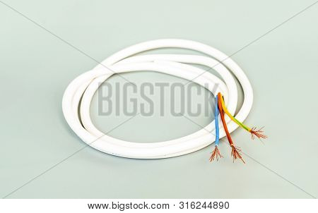 Three-core Cable In White Isolation On A Gray Background