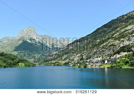 Stunning Water Landscape On A Summer Day Created By A Dam In South Of France.