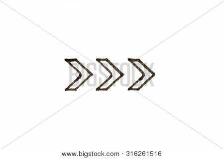Black Color Handdrawing In Arrow Shape On White Paper Background